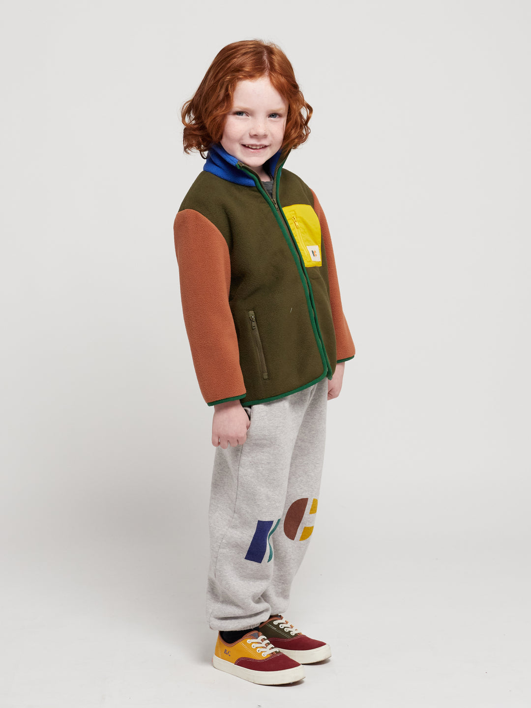 Enfant avec Veste en polaire kaki, brun, bleu, vert et jaune 