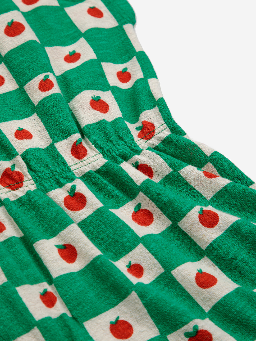 Une-pièce pour enfant en coton bio à carreaux verts et blancs avec des petites tomates