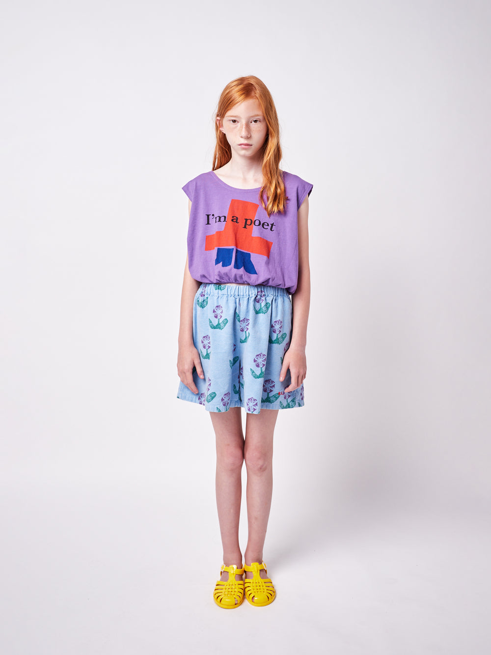 girl wearing Bobo Choses tee and blue woven culotte with purple floral print